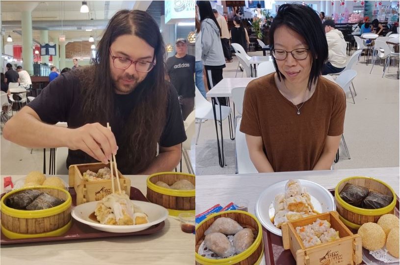 Artists Andrew Tham and Mabel Kwan sit at tables of food, Andrew is holding chopsticks and Mabel slightly smiling looks down at the food. The two photos are spliced together in a balanced composition. 